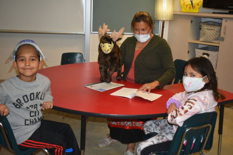 Helene Cote, a Grade 1 teacher at Chief Gabriel Cote Education Complex, used a large puppet to talk about antlers in class last week. With her were students, Narvel Genaille-Cote and Taveah Whitehawk.