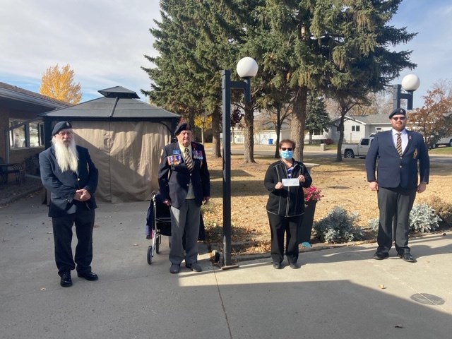 Participating in a cheque presentation from the legion to the Estevan Regional Nursing Home were, from left, Royal Canadian Legion Estevan branch president Jim (Frosty) Forrest, Second World War veteran Jim Spenst, nursing manager Christine Stephany and legion donations committee chairman Tyson Wilhelm. Photo submitted