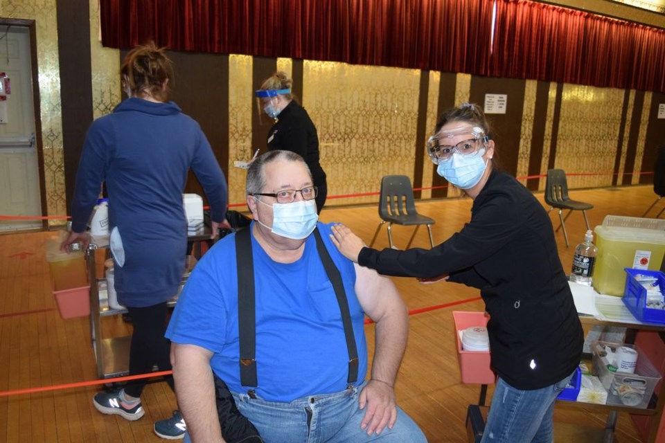 At the flu vaccine clinic in Canora on October 19, Gerry Pikula of Amsterdam received his vaccination from Tracy Schappert, RN, Kamsack Public Health. Clients were pre-screened for COVID symptoms prior to the clinic.