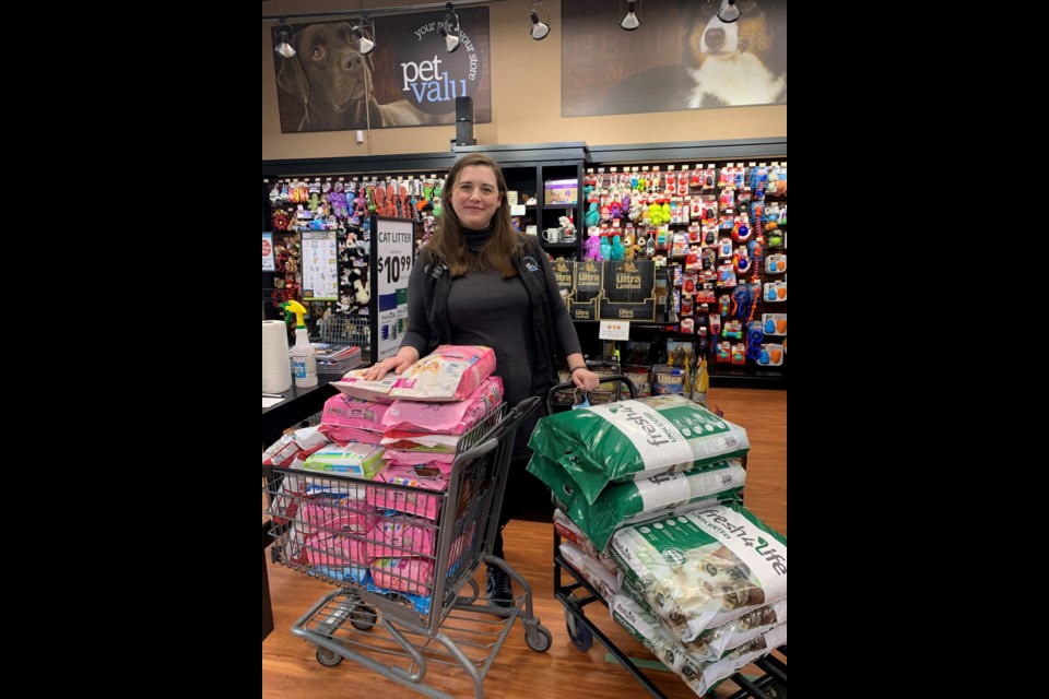 Store owner Sarah Kowalchuk with the donations. Submitted Photo