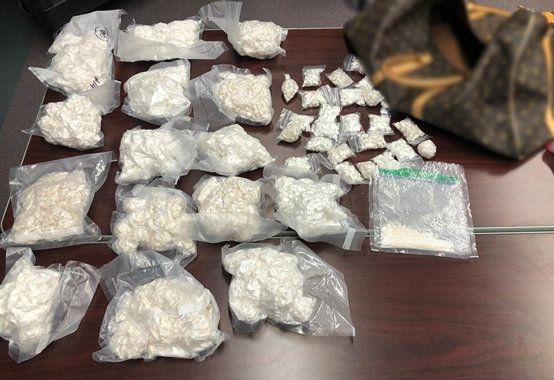 The North Battleford RCMP gang unit raided two homes and charged five people after seizing firearms, cash and a large quantity of drugs on Nov. 21. (RCMP photo)