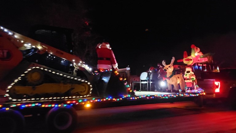 An evening view as the Dec. 3 Winterlites parade passed by. Pictured is James Alexander with a trucking entry. Photos by Sherri Solomko