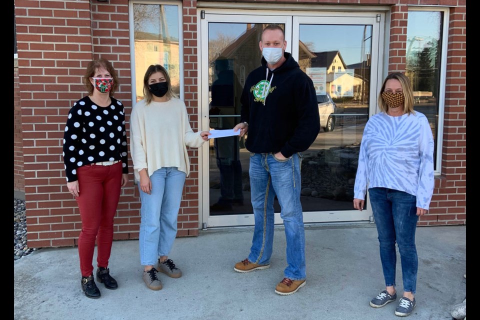 From left, Shelley Dayman, Jolie Bayda, Danny Blackburn and Char Seeman met on the steps of St. Giles Anglican Church to pass on numerous cheques from Estevan oilfield companies to the Estevan Community Hamper Association and Angel Tree. Dayman, Bayda and Seeman are on the committee, while Blackburn made the presentation. Photo submitted