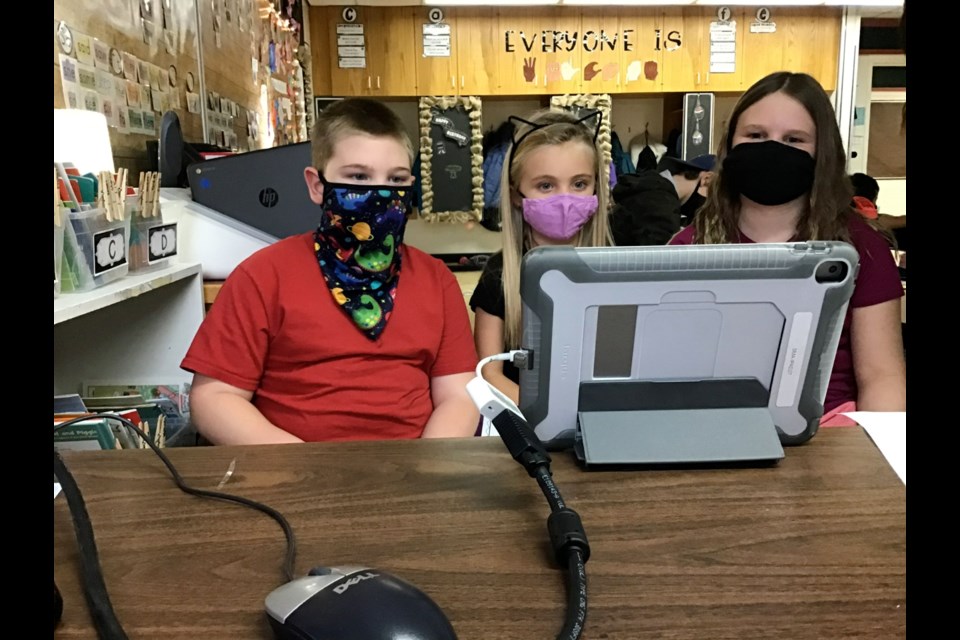 From left, Parker Moffat, Brae Wolensky, Meredith Knoll were among the St. Mary’s School students involved with Virtual Video Pals. Photo submitted