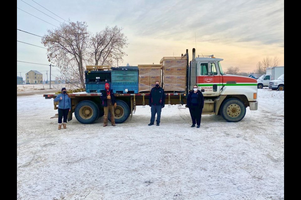 The truck in Yorkton was loaded with 78 food hampers and turkeys to be delivered to Kamsack. From left, were: Candice Nelson (SIGN Positive Impact), Douglas Nelson (Norquay Co-op), Justin Petelski (Norquay Co-op), and Captain Mary Tim (The Salvation Army).