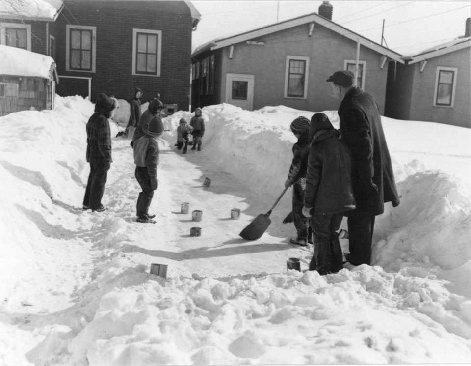 A vintage photo of children curling. Provincial Archives of Saskatchewan