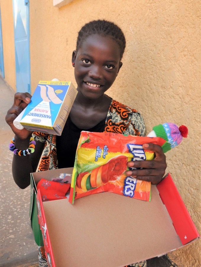 A child in Senegal checking out their Canadian-packed Operation Christmas Child shoebox. Photo submi