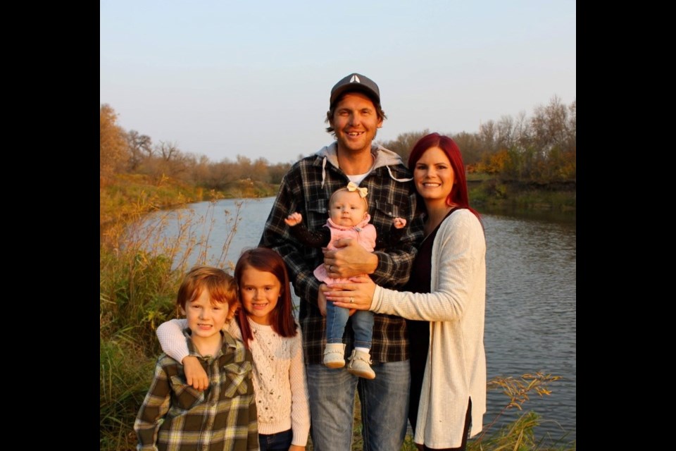 From left, Kasey, Hailee, Riley Ann, Ryan and Stephanie Harris helped another family, paying it forward for help they received when they were in need. Photo submitted