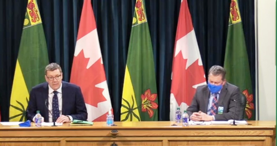 Premier Scott Moe, left, announced funding to help Saskatchewan’s Vaccine and Infectious Disease Org