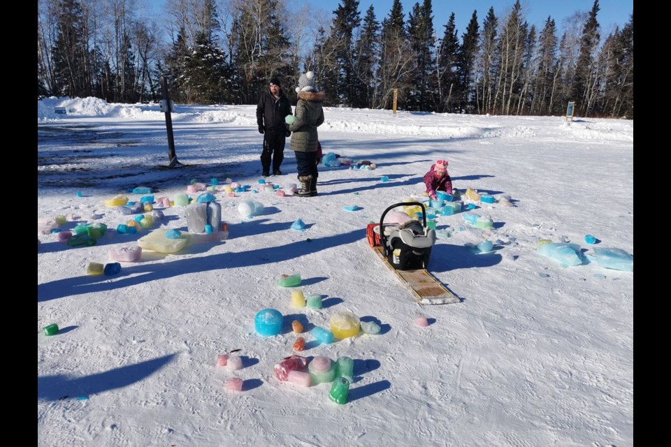 Blocks of ice that had been tinted with food colouring became children’s building blocks for fairy ice castles. The winter scene at Duck Mountain Provincial Park attracted a number of local families over the holiday long weekend.