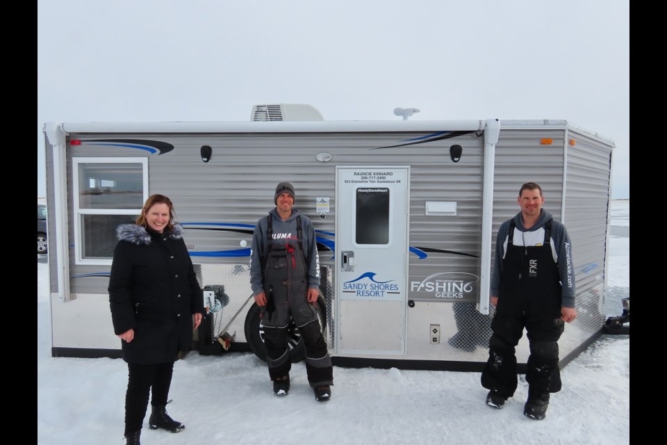 Sandy Shores Resort owner Rauncie Kinnaird with noted fishermen Adam and Sean Konrad.