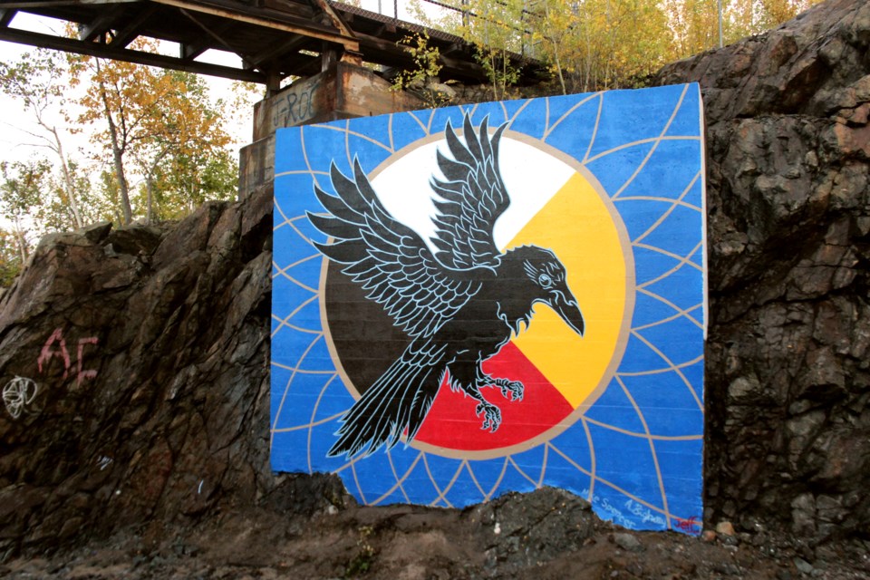 The first piece produced by the Pineroot Mural Festival group, located just off the Perimeter Highway, shows a traditional First Nations medicine wheel and a raven. The group behind the piece is now organizing two pieces to be painted in Flin Flon this summer. - FILE PHOTO