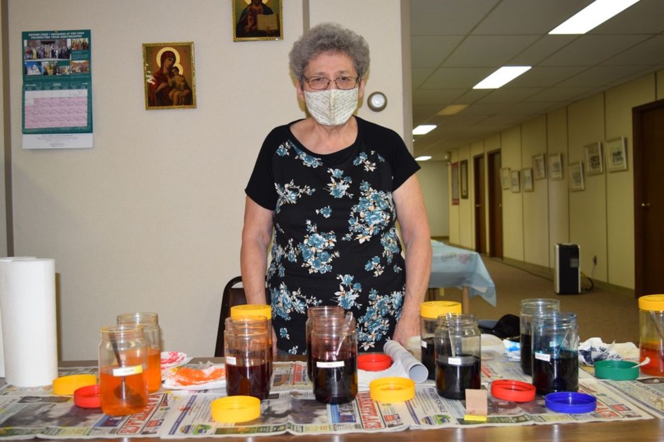 Lil Grywacheski was a helper during the workshop and made sure participants had a variety of different dye colour options to choose from for their eggs.