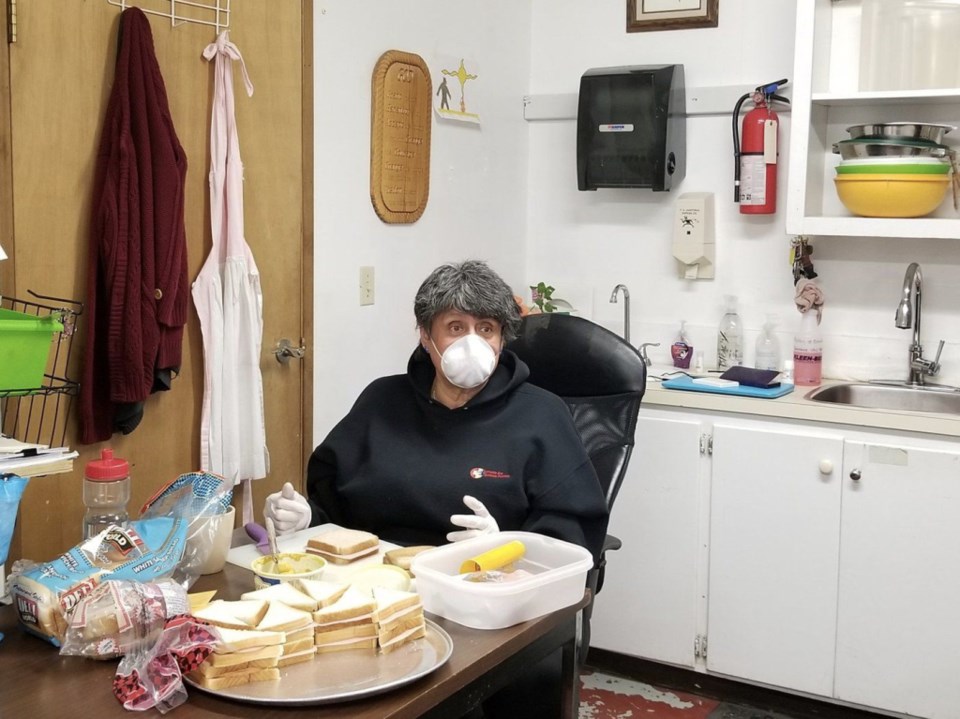 Outreach program director Jackie Ballantyne at Scattered Site making sandwiches. Photo by Michael Br