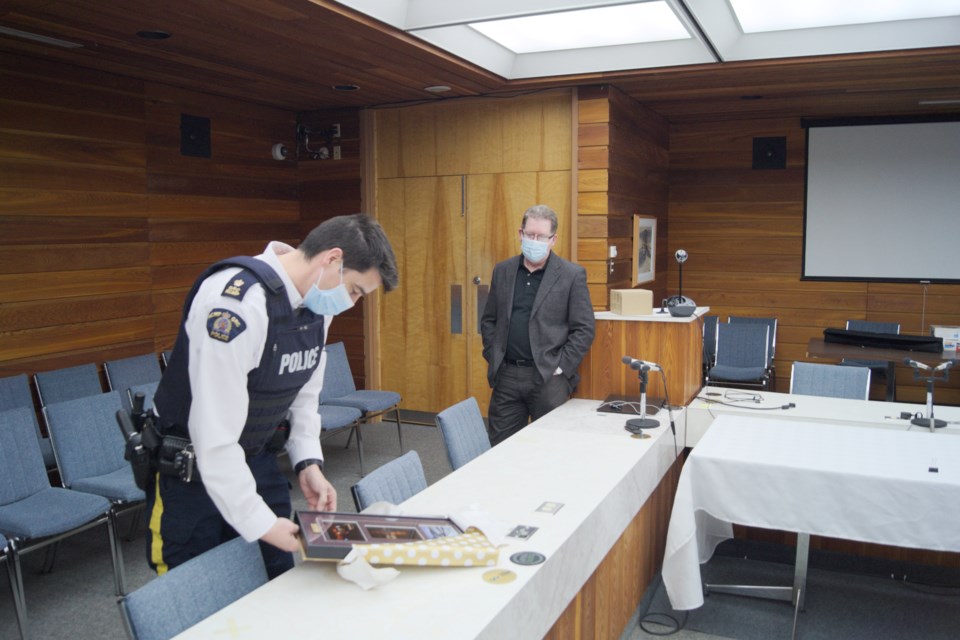 Mayor David Gillan presents a farewell gift to departing Battlefords RCMP Officer in Charge Tom Beck. Submittted