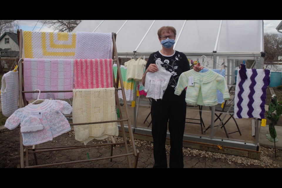 Josie Stroeder, the leader of the Humboldt and Area Guardian Angels holds up some of the group’s pieces which will be donated to charities later this year. Photo by Jessica R. Durling