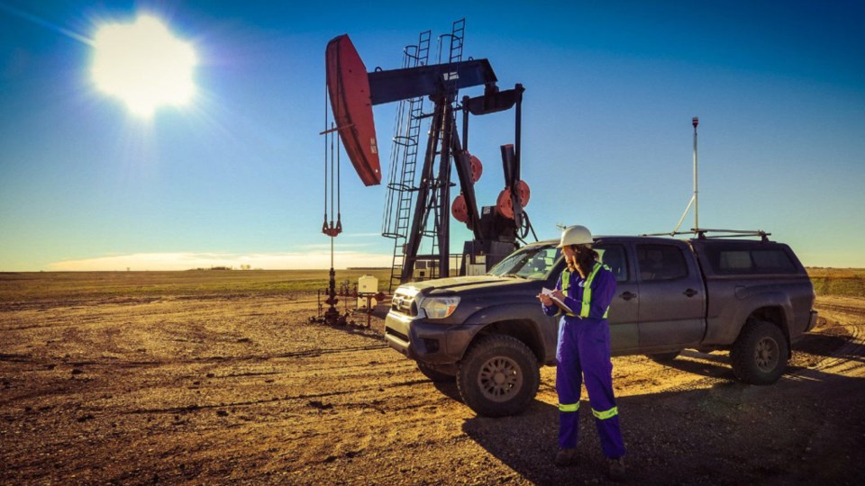 A researcher records methane emission measurements at an oil and gas site in Saskatchewan in 2015. P