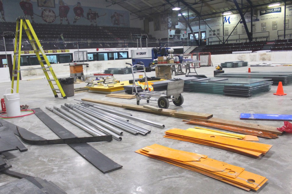 The Whitney Forum is a hive of activity, filled with supplies and materials as City of Flin Flon workers replace a segment of the rink’s boards. The boards on the rink’s north side, near the arena’s lobby, are being replaced. - PHOTO BY ERIC WESTHAVER