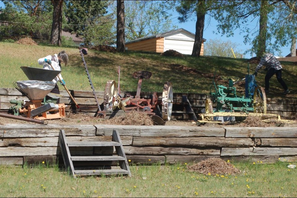 Greta German, left and Barb Wagar raked up some old grass and debris on the grounds of the Sturgis Station House Museum in preparation for opening for the new season. The cleaning bee took place on May 19.