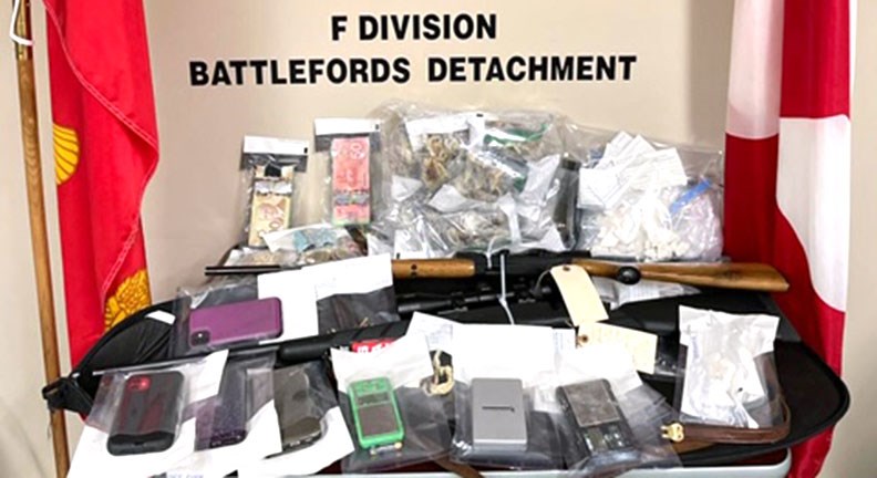 RCMP seized half of a pound of cocaine, half of a pound of psilocybin, (magic mushrooms), two firearms and about $3,500 in cash from a residence in Battleford. Four people were charged.