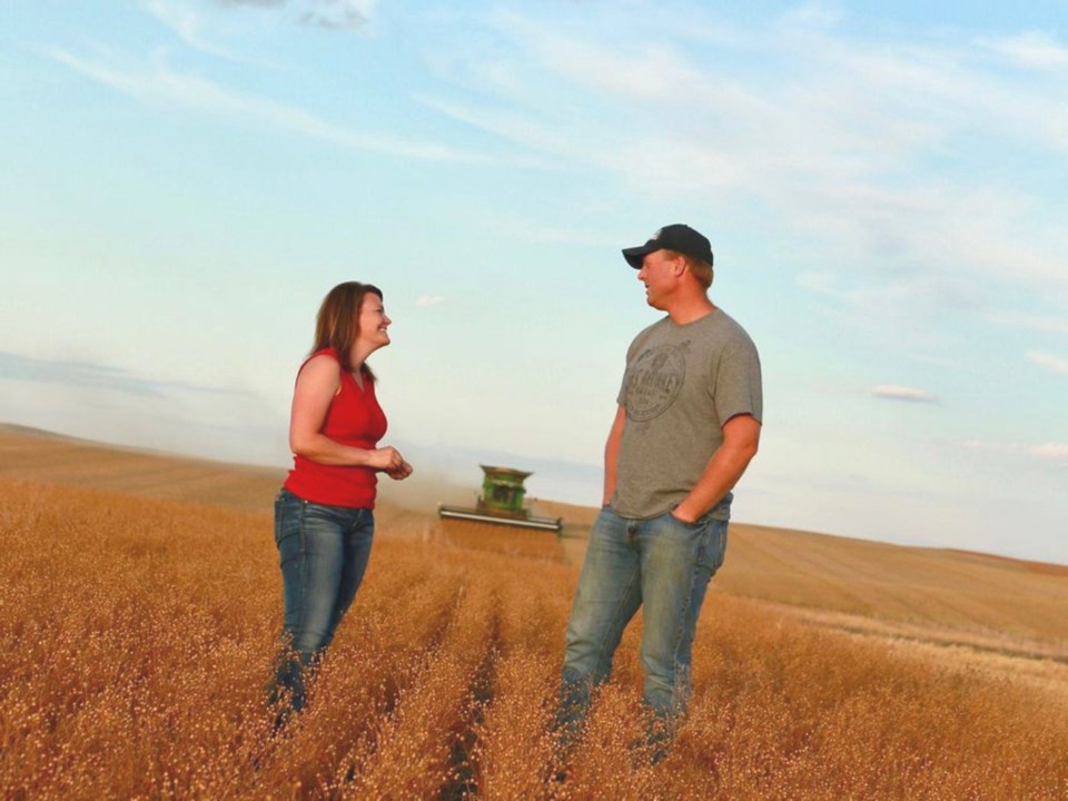 Tannis and Derek Axten on their farm in Minton, Saskatchewan. Becky Lunde Photography