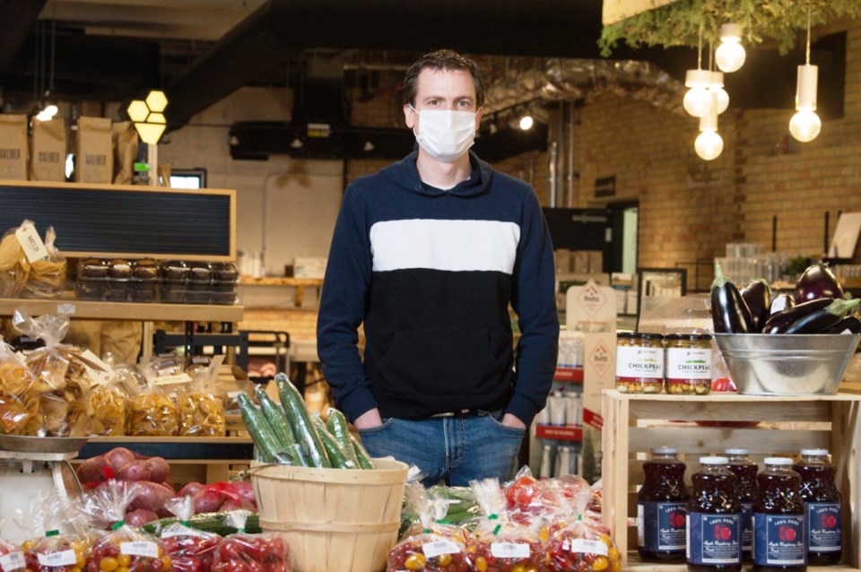 Tim Shultz, co-owner of Local & Fresh grocery store, stands behind local produce being sold in the s