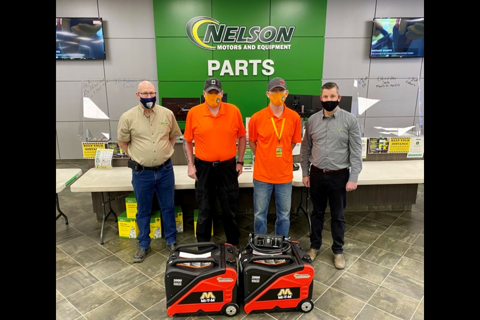 In the photo, from left, are Derek Galarneau with Nelson Motors, Mickey Quigley, Derek Layden with SESKSAR, and Jaret Nelson with Nelson Motors.