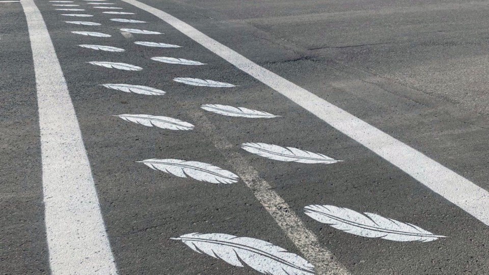 A Hay River crosswalk bears feathers in recognition of people impacted by residential schools. Town