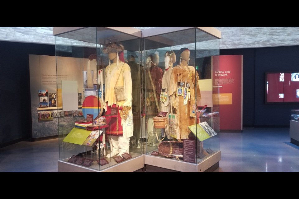 Traditional garments worn by different First Nations tribes are in display inside the visitor center at Wanuskewin Heritage Park.