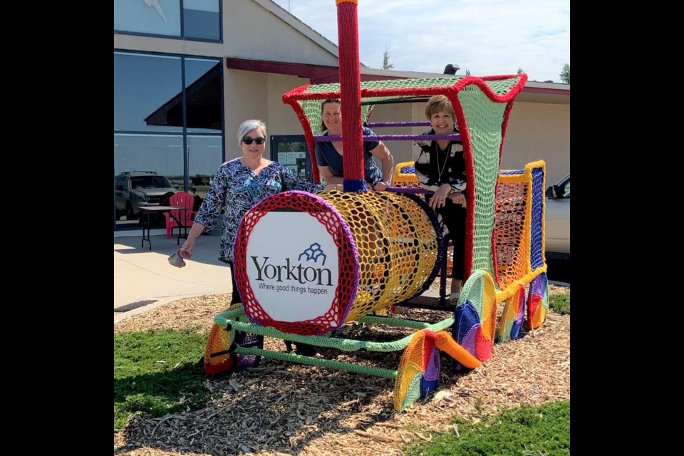 Tourism Yorkton's Randy Goulden with artists Tonya Vermette and Michelle Easton.