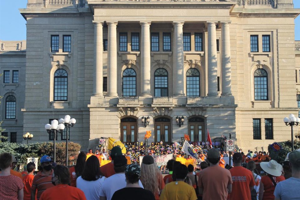 Hundreds of people gathered at the Legislative Building for a rally and candlelight memorial for residential school children, organized by local Indigenous leaders.