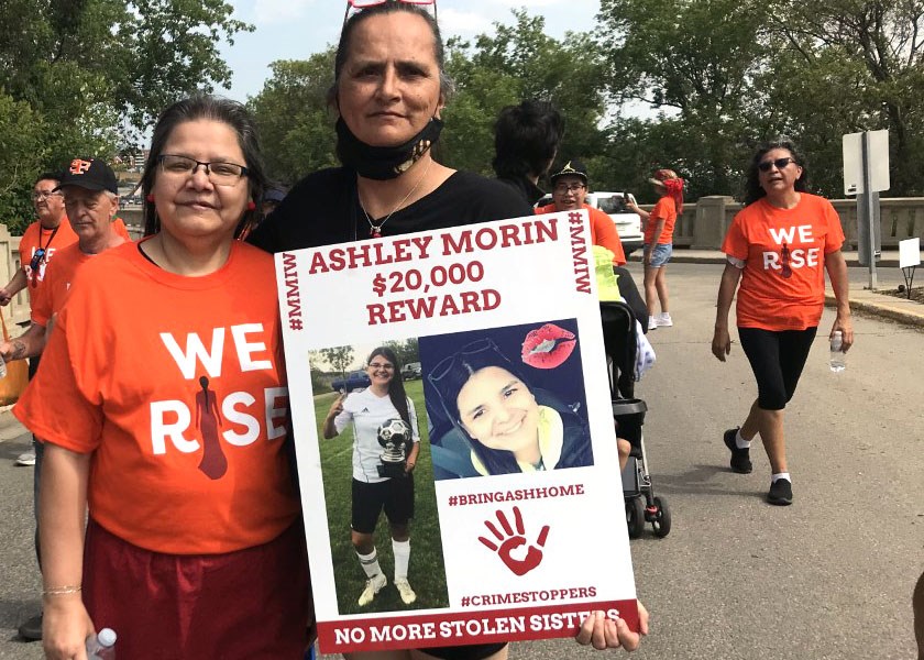 Ashley Morin’s mom, Diane Morin, left, and Morin family spokesperson Krista Fox participate in the annual MMIWG walk in Prince Albert July 8.