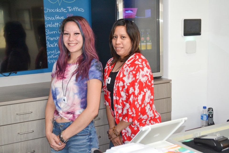 Tianna Threinen, left, and Naomi Rossen are eager to greet customers at Peace of Mind Cannabis in Estevan.