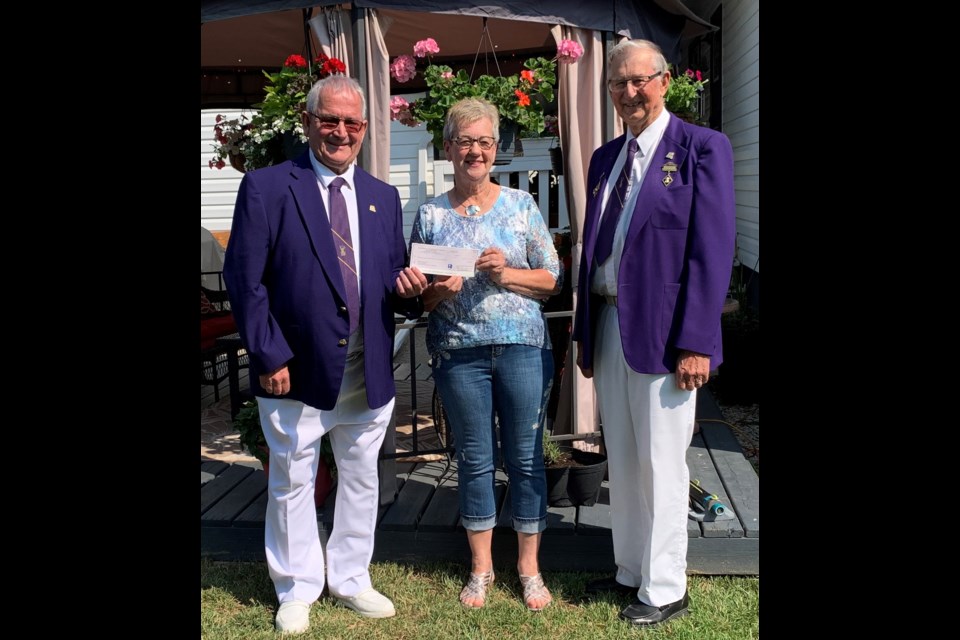 Foundation Chairman Joe Calder and Senior Homes Chairman Tony Koval present 50/50 Prize to Heather Buziak of North Battleford. Photos submitted