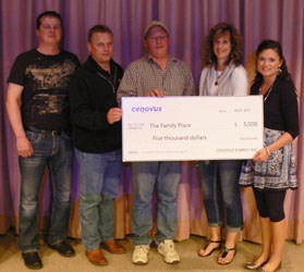 Precision Drilling employees Henry Krowicki, Shaun Robstad, and Brennan Zackrisson presented a cheque for $5,000 to Family Place representatives Shelby Hoium and Dawn Gutzke.