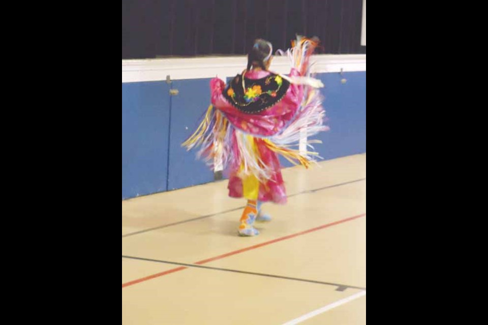 Payton Sparvier performs a traditional First Nations dance in the gymnasium.