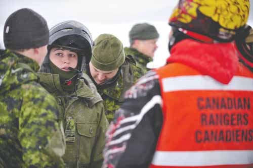 Lieutenant Samantha Cross of the Fort Garry Horse Regiment, 2 Platoon Arctic Response Company Group issues her final orders before moving out to Candle Lake, Saskatchewan on February 17.