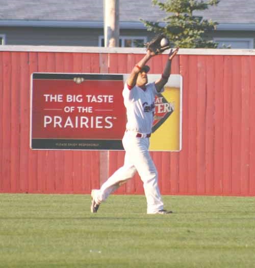 Outfielder James Green collects a fly ball out.