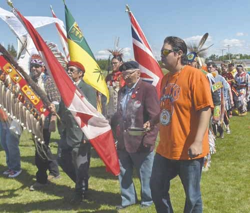 Flag carriers lead the grand entry at the first annual YRHS youth pow wow held Friday.