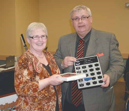 The Volunteer of the Year Award presented to Sandra Baron from club president Lyle Walsh.