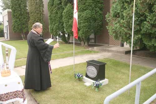 Father Mel Slashinsky Holy Transfiguration Ukrainian Orthodox Church in Yorkton blesses the commomemorative plaque.