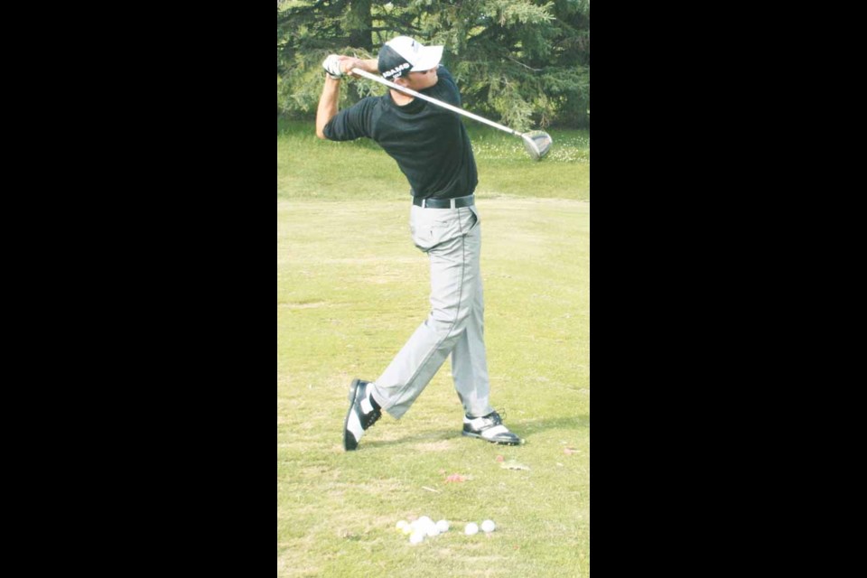 Alberta native Jamie Sadlowski blasts a golf ball into the sky during a demonstration at Deer Park golf course.