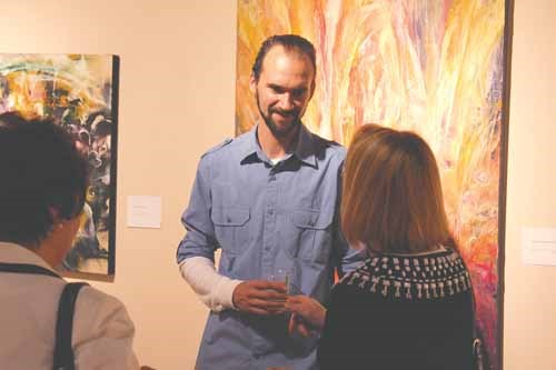 Painter Paul Nickless meets with fans.