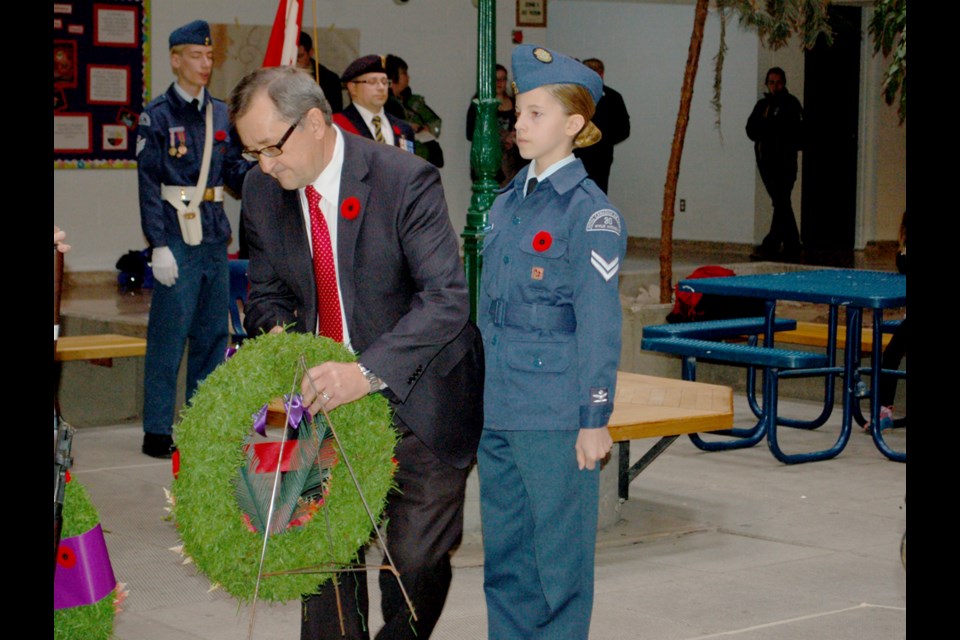 Souris-Moose Mountain MP Ed Komarnicki lays a wreath down at the Remembrance Day ceremony in Estevan on Nov. 11.