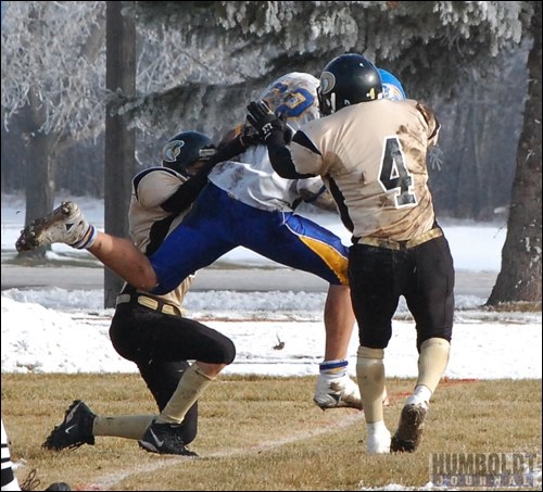 HCI's Darren Henry (62) ran the ball into the end zone for his team's first touchdown despite the efforts of two Kindersley Kobras during their game on October 30. HCI never gave up their lead, taking a 49-0 lead into the second half on their way to wining the Provincial quarter-final 50-14.
