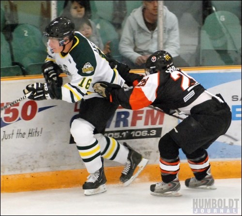 Jordan Hirano (right) of the Yorkton Terriers  tried to catch Bronco left-winger Adam Antkowiak against the boards, but couldn't quite complete it during the Broncos-Terriers game.