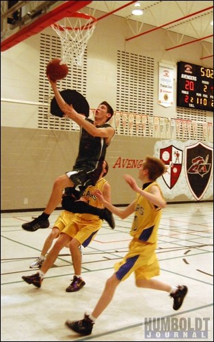 Brent Berscheid (5) of the Lake Lenore Lancers takes it to the hoop as he gets above three members of the Wynyard Bears during this layup. The Bears eked out a 57-54 victory, after giving up a 10-point lead. Wynyard went on to win the Three Lakes Avengers senior boys' basketball tournament held in Middle Lake December 3-4.