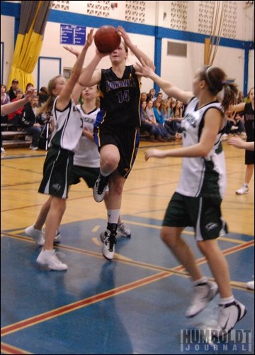 Paige Crozon of the HCI Mohawks weaves her way through a crowd of Lake Lenore players for a layup during a senior girls' basketball game in Humboldt on December 10. The two teams were competing in the annual H.I.T., which was won by HCI.