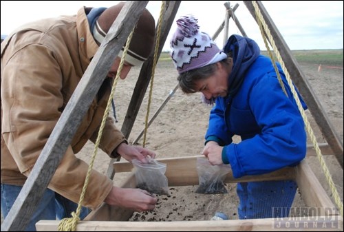 Brenda Duerr and Jonathan Novecosky sift through dirt to find some small bones during the archeological dig.