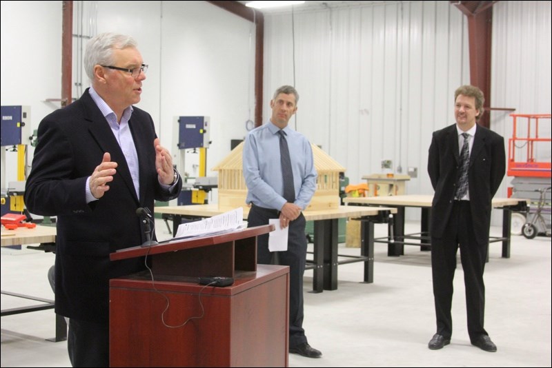Premier Greg Selinger officially opened the Technical Vocational Institute, beside Hapnot Collegiate, on Wednesday. Looking on are Hapnot principal Brent Bedford (centre) and teacher Colin Davis.